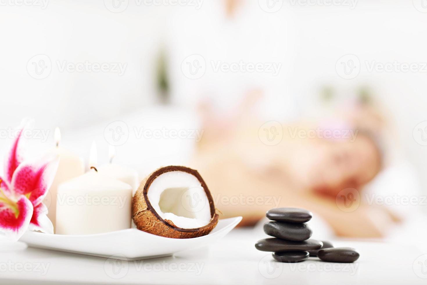 Two beautiful women getting massage in spa photo