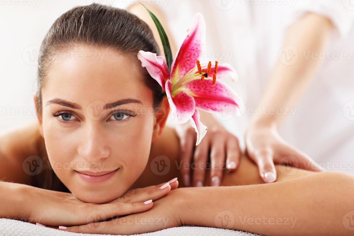 Beautiful woman getting massage in spa photo