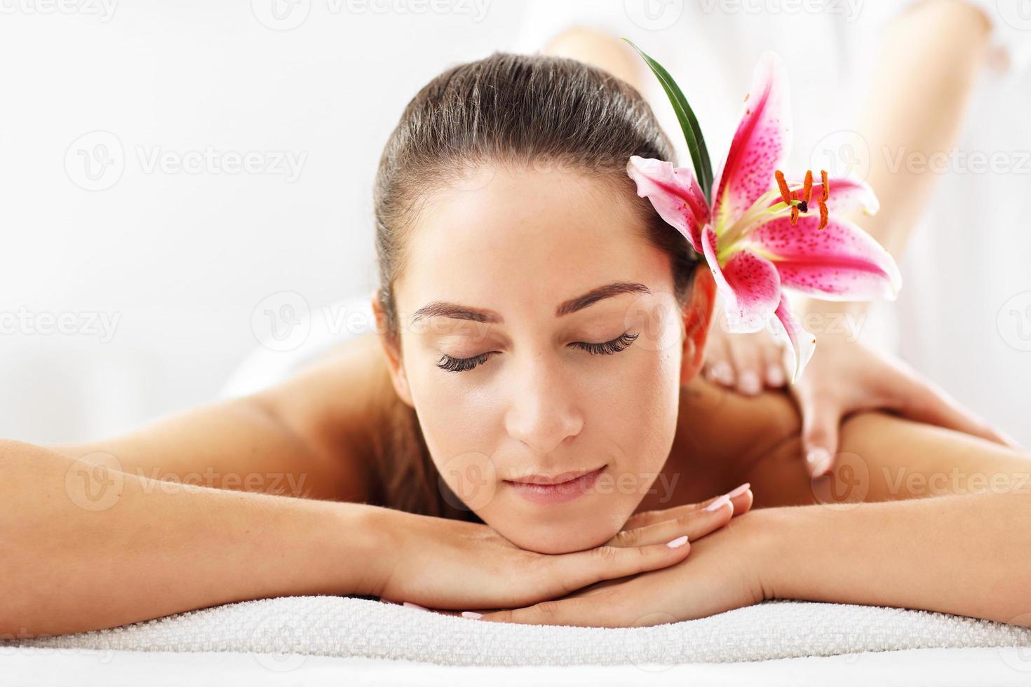 Beautiful woman getting massage in spa photo