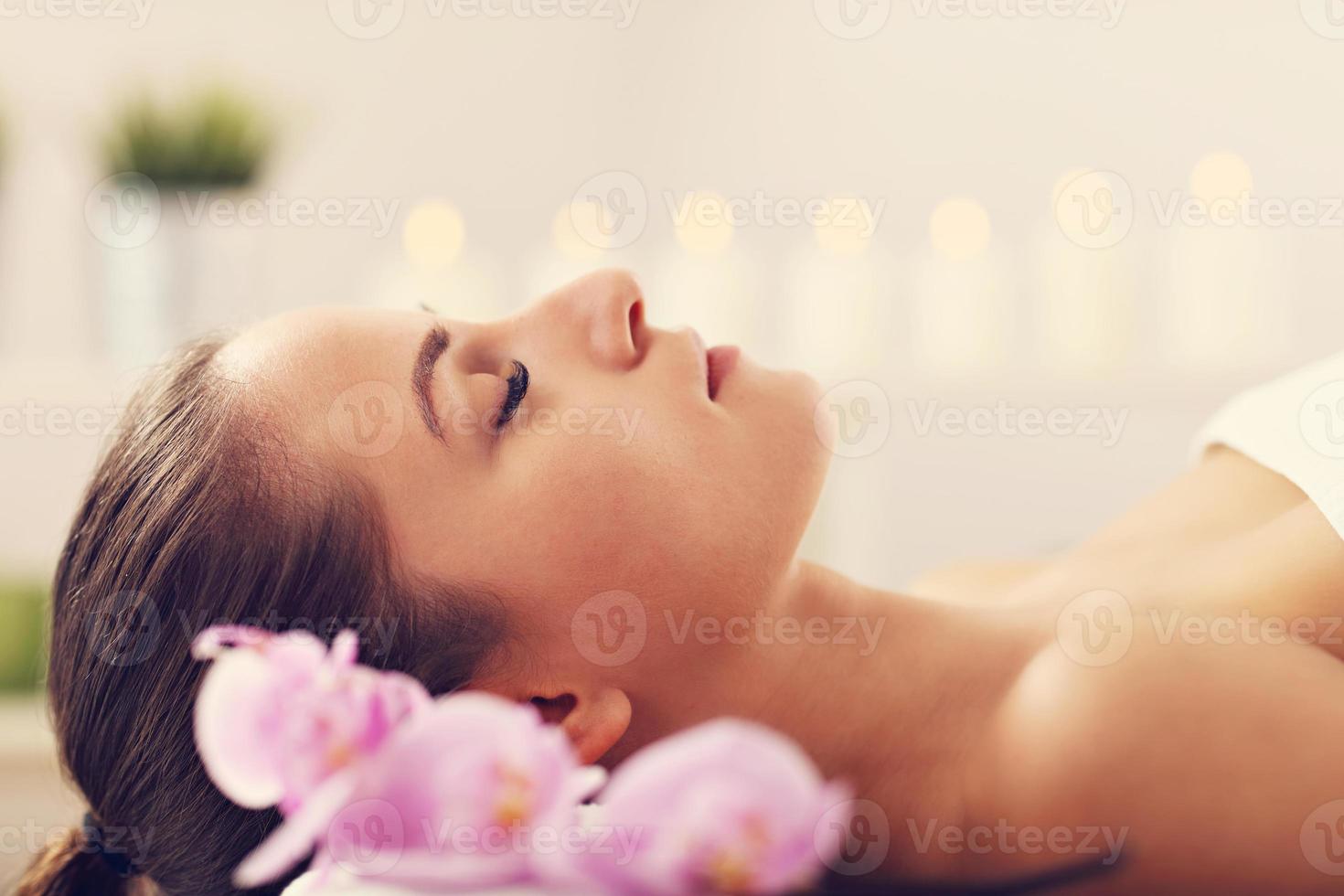 Beautiful woman getting massage in spa photo