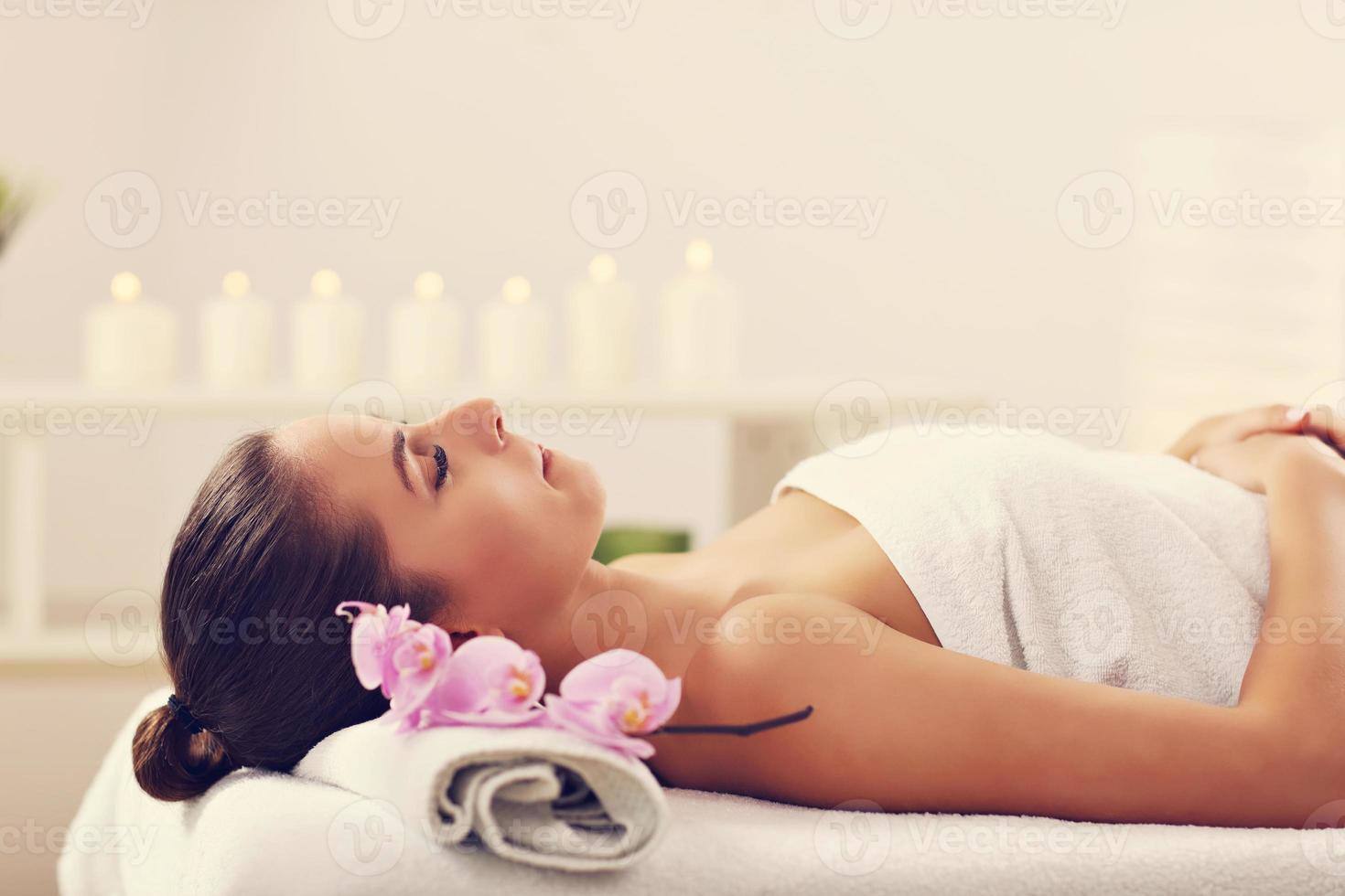 Beautiful woman getting massage in spa photo