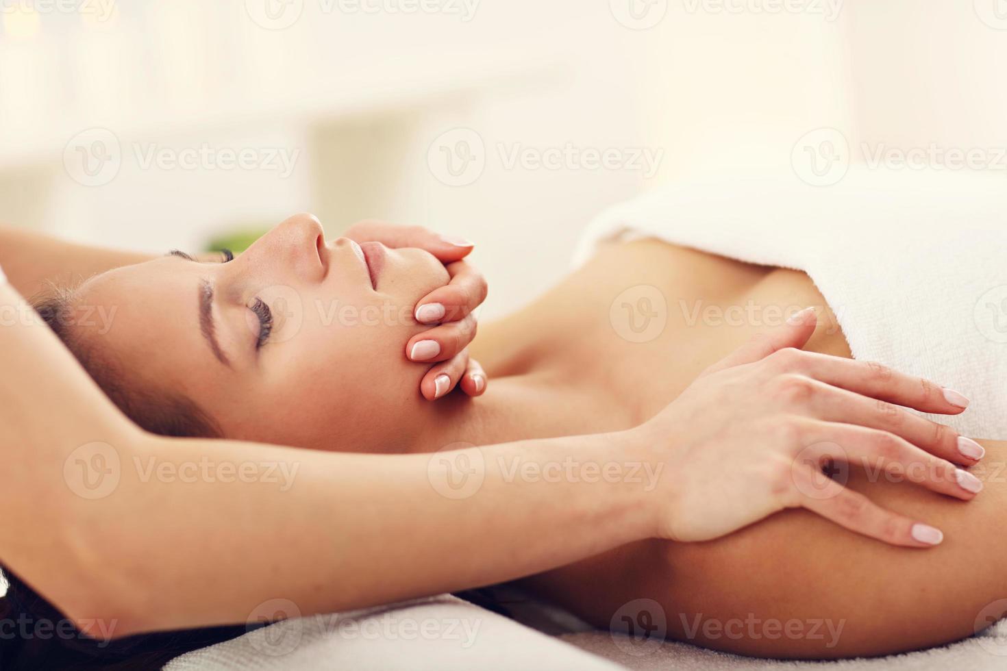 Beautiful woman getting massage in spa photo