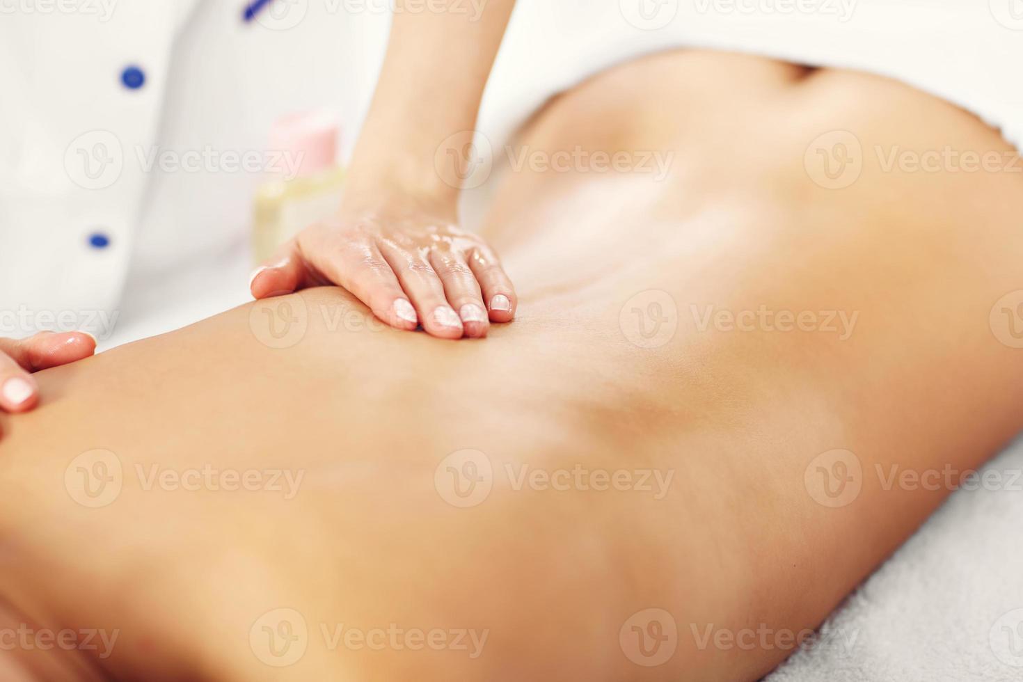 Beautiful woman getting massage in spa photo