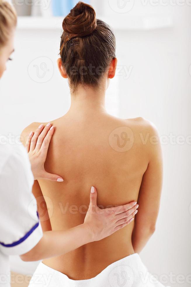 A picture of woman having back therapy photo