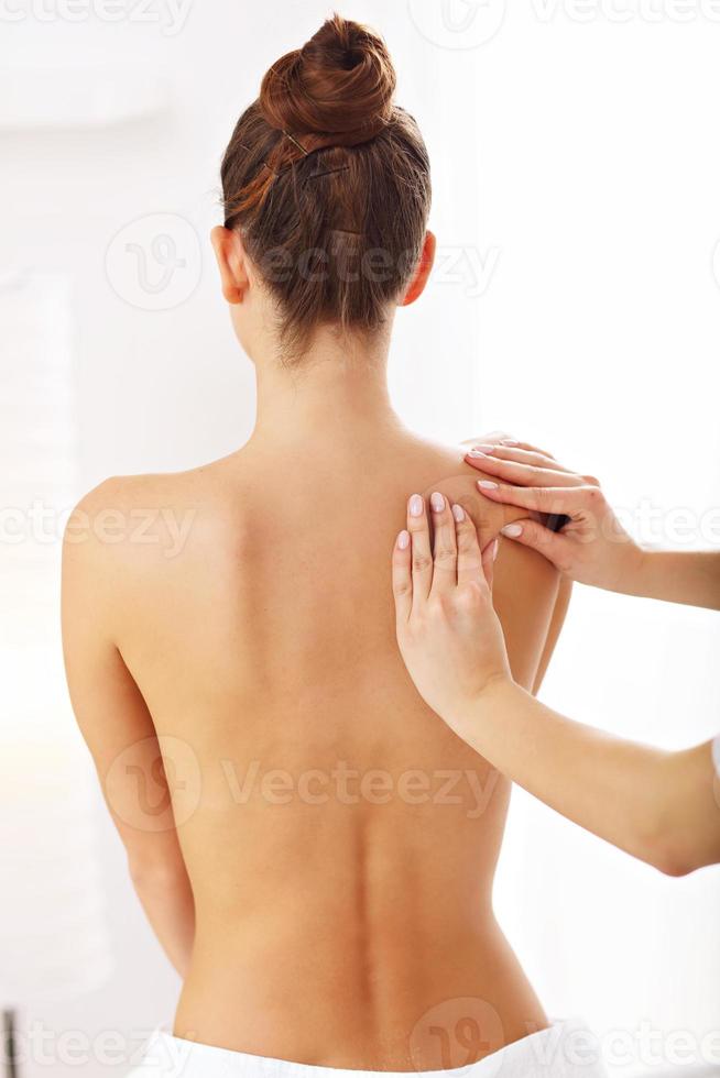 A picture of woman having back therapy photo