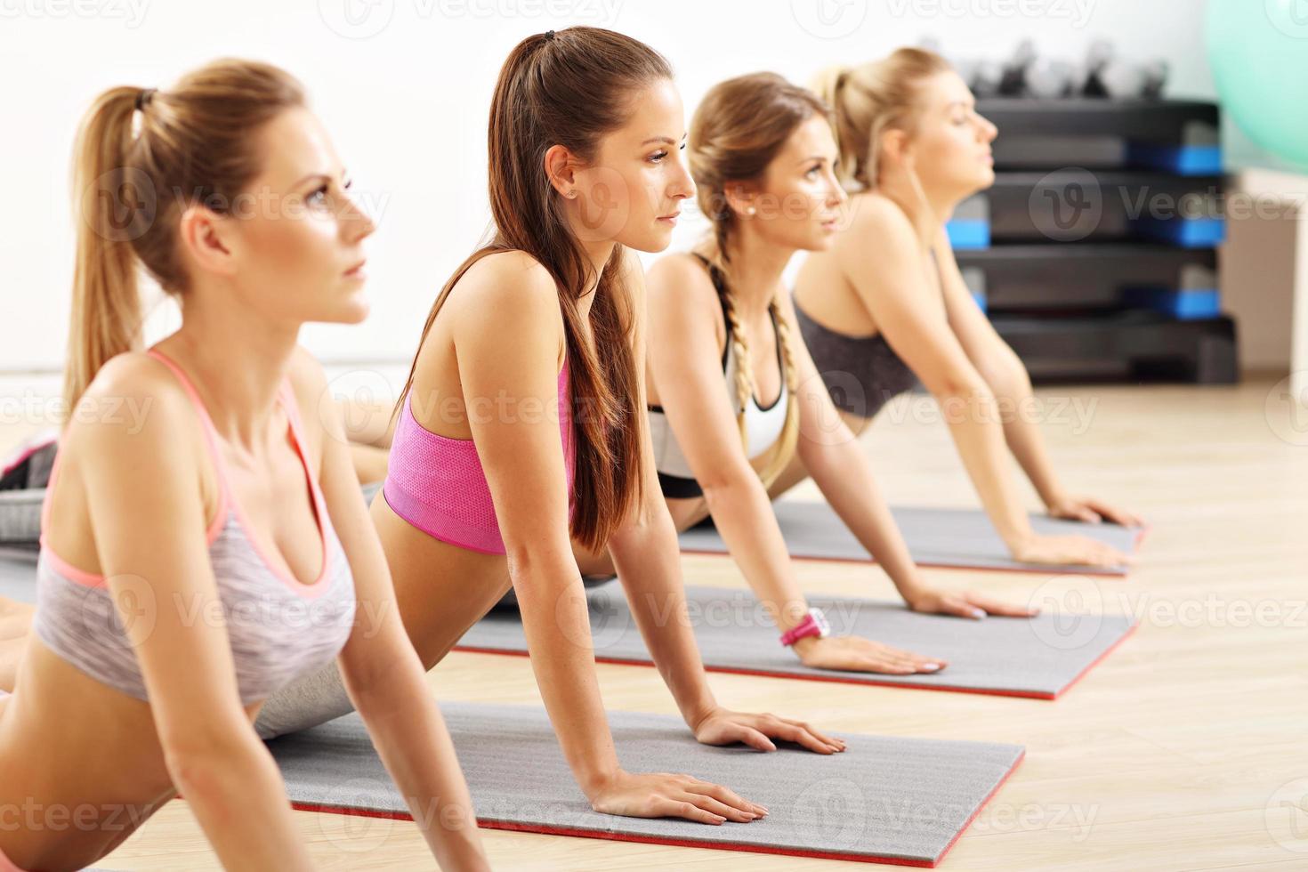 Young women working out in gym photo