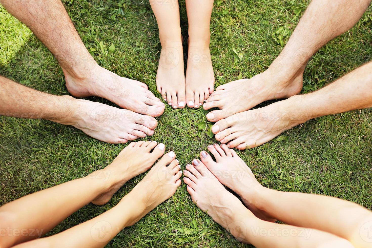 Friends group having fun together on grass photo