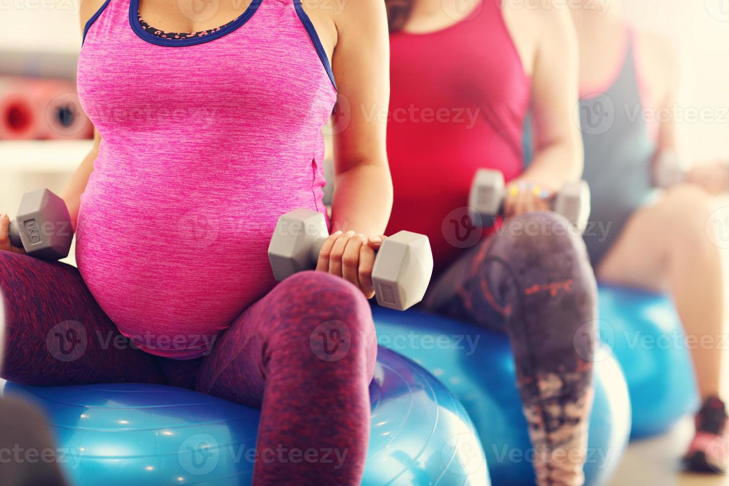 Group of pregnant women during fitness class photo