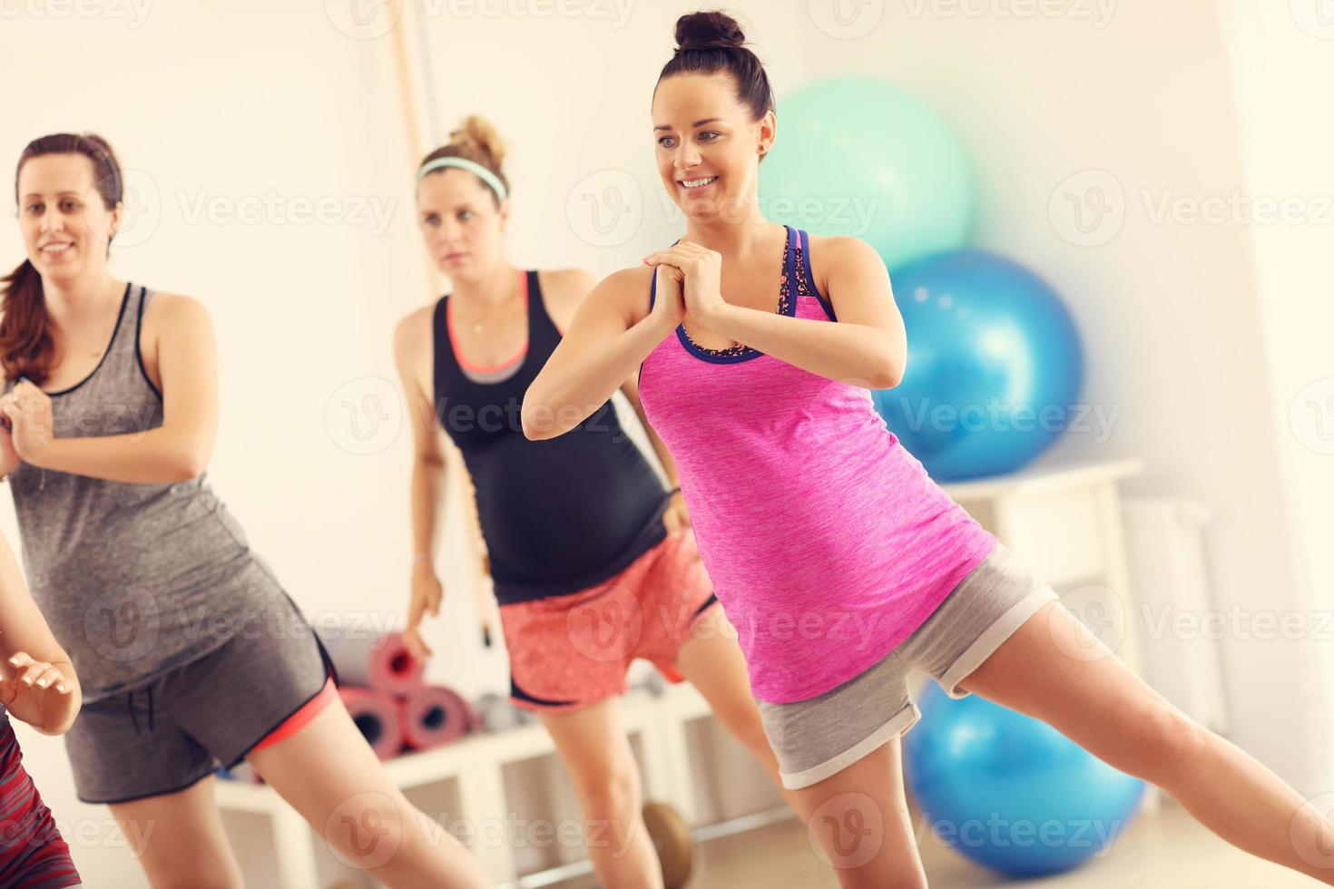Group of pregnant women during fitness class photo