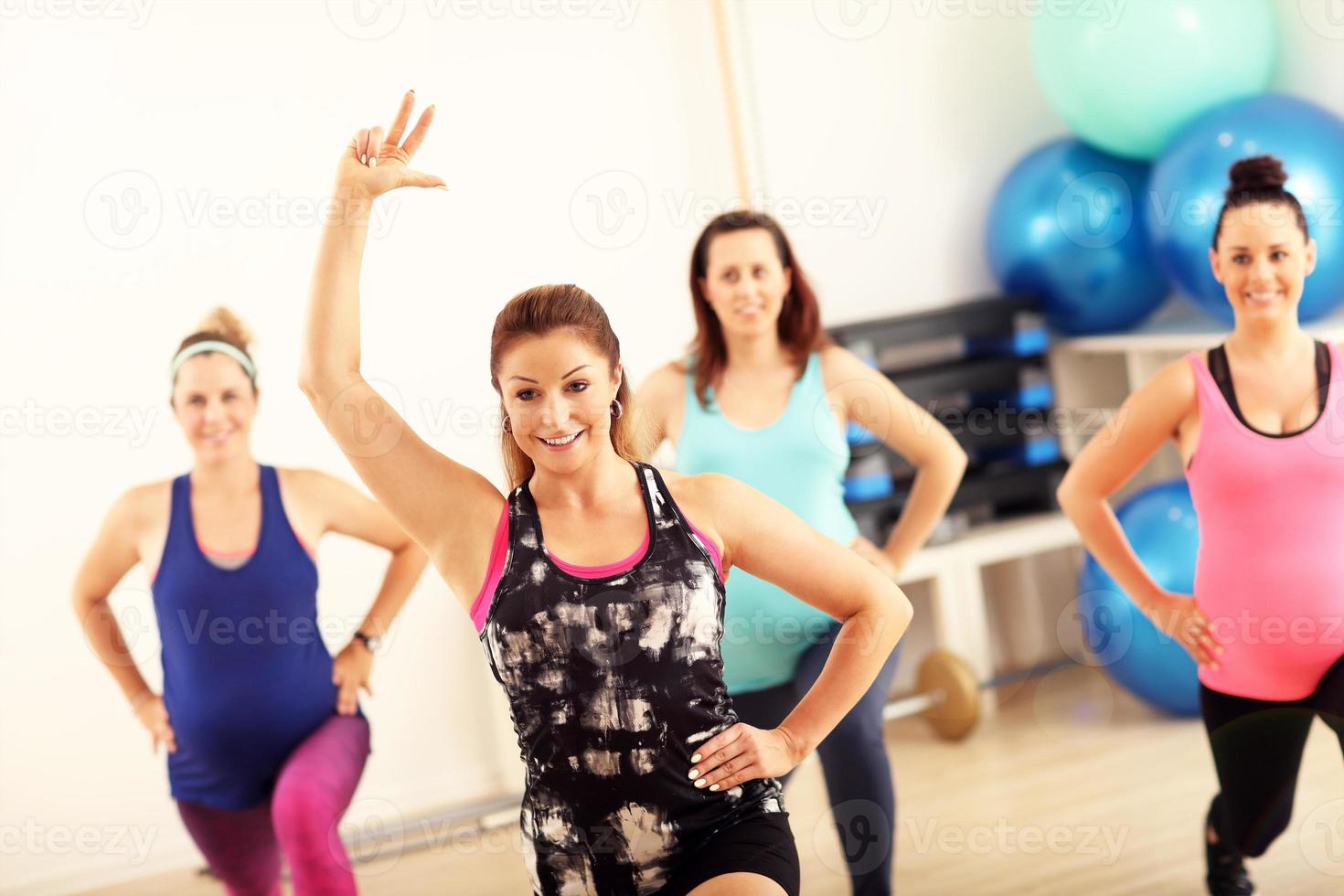 Group of pregnant women during fitness class photo