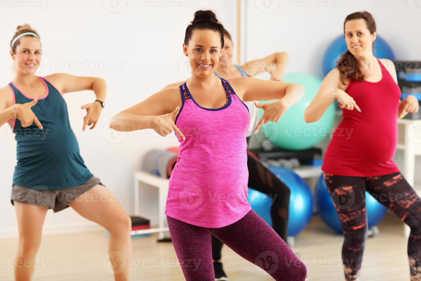 Group of pregnant women during fitness class photo