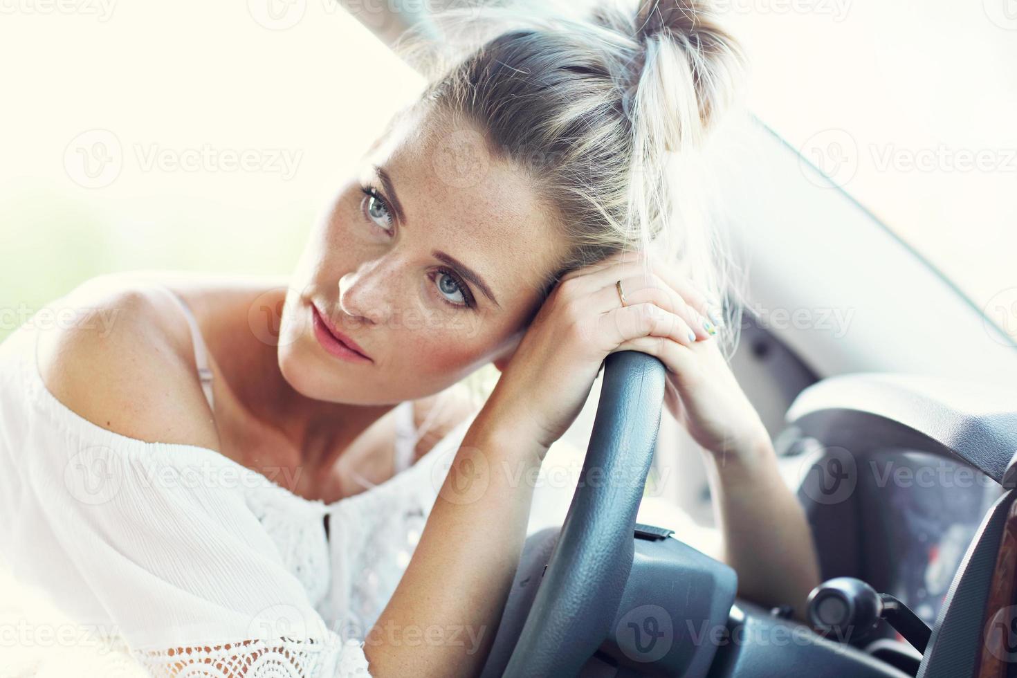 Transportation concept - tired woman driver photo