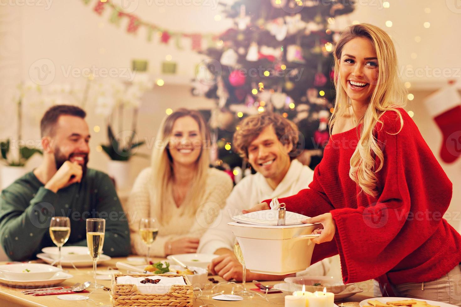 Group of family and friends celebrating Christmas dinner photo