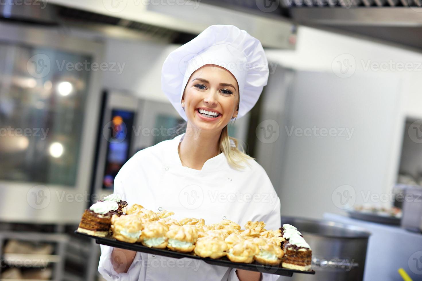 Busy chef at work in the restaurant kitchen photo