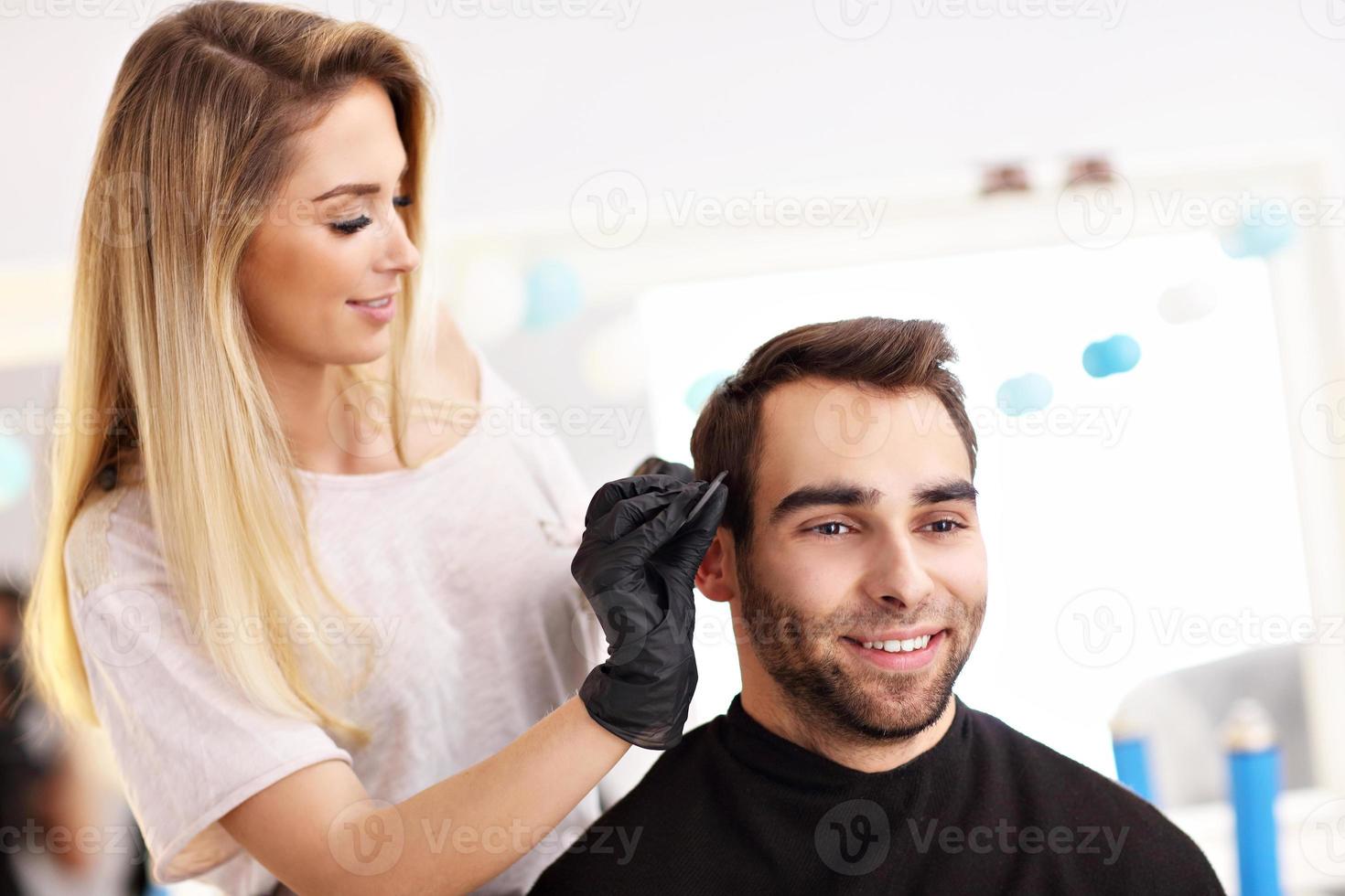 Adult man at the hair salon photo