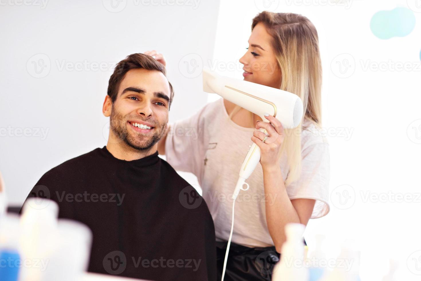 Adult man at the hair salon photo