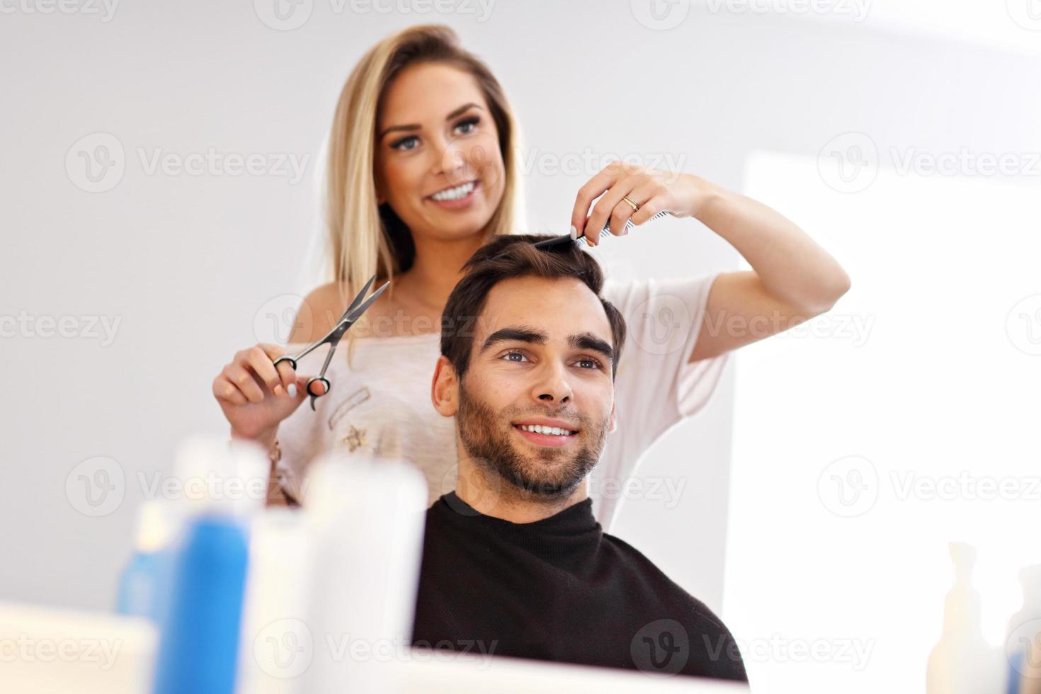 Adult man at the hair salon photo