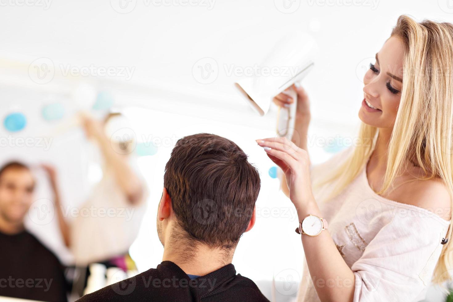 Adult man at the hair salon photo