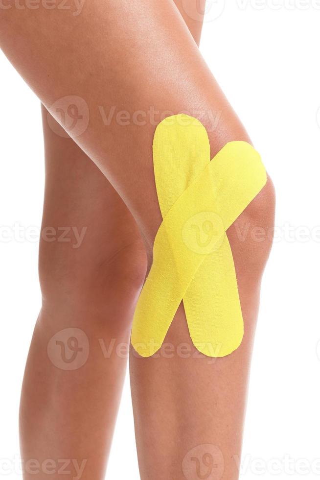 Picture showing special physio tape put on injured knee photo