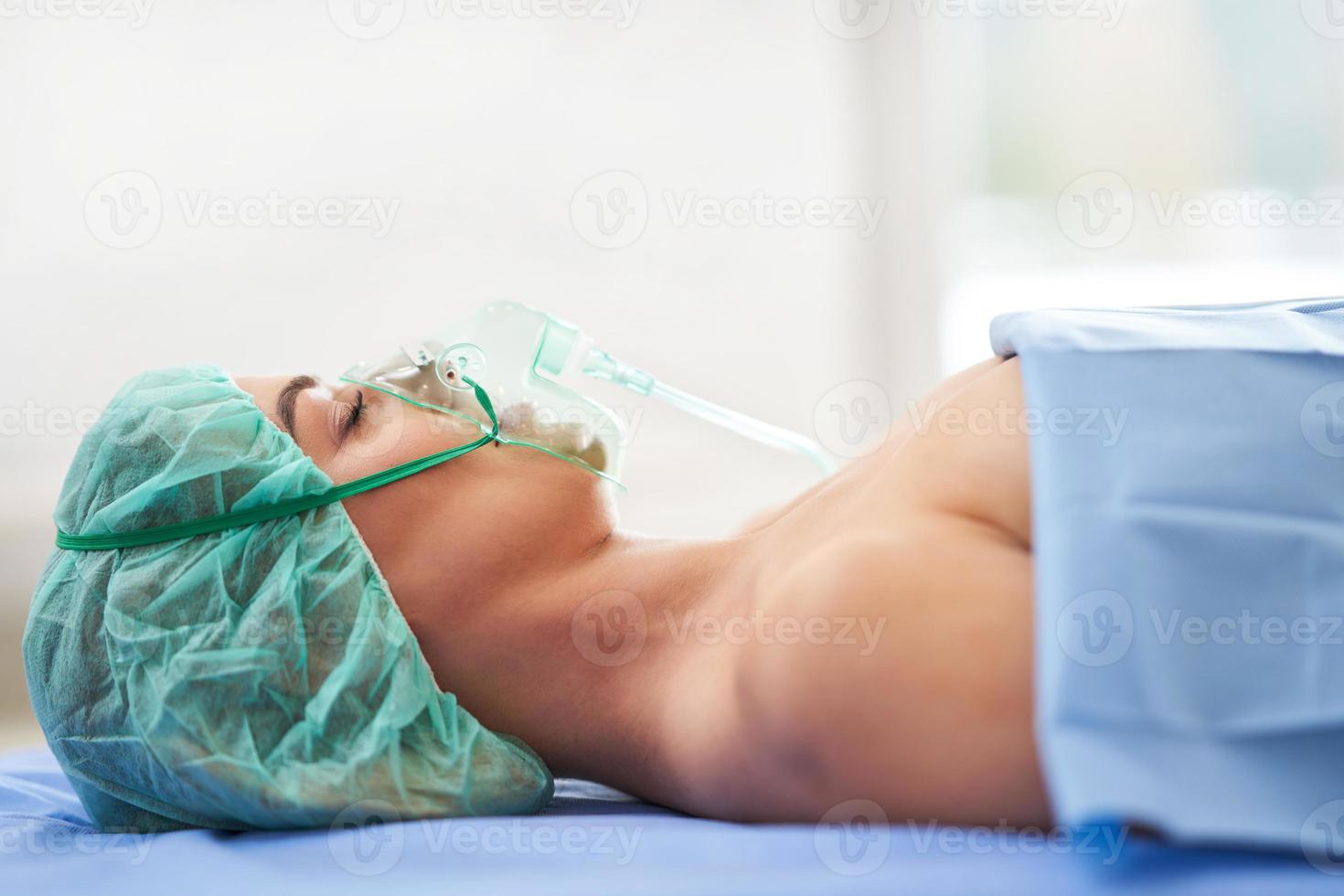 Female patient having respiratory therapy recovering in the hospital photo