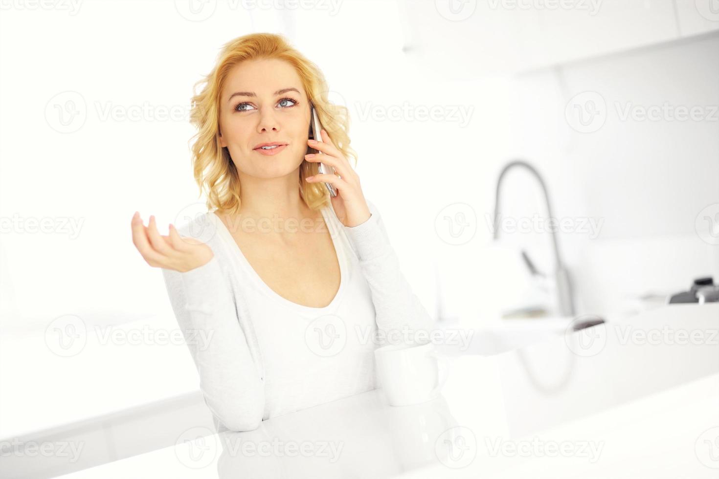 Woman talking on the smarphone photo