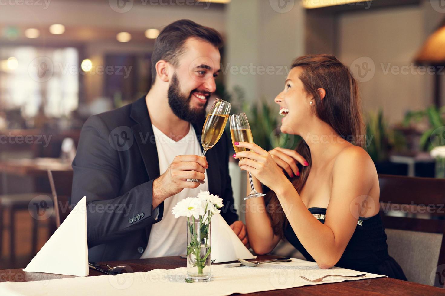 Romantic couple dating in restaurant photo