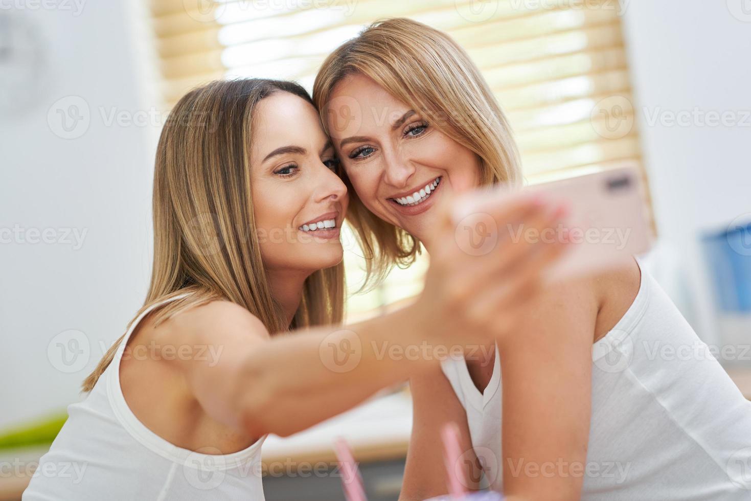 LGBT Lesbian couple love moments in the kitchen happiness concept photo