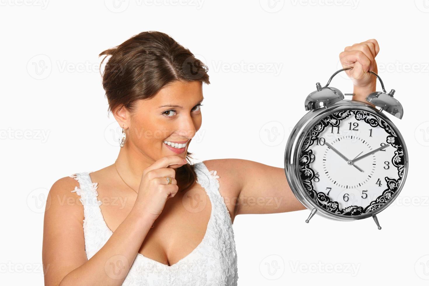 Bride with alarm clock photo