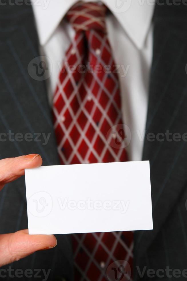 Business man holding business card photo