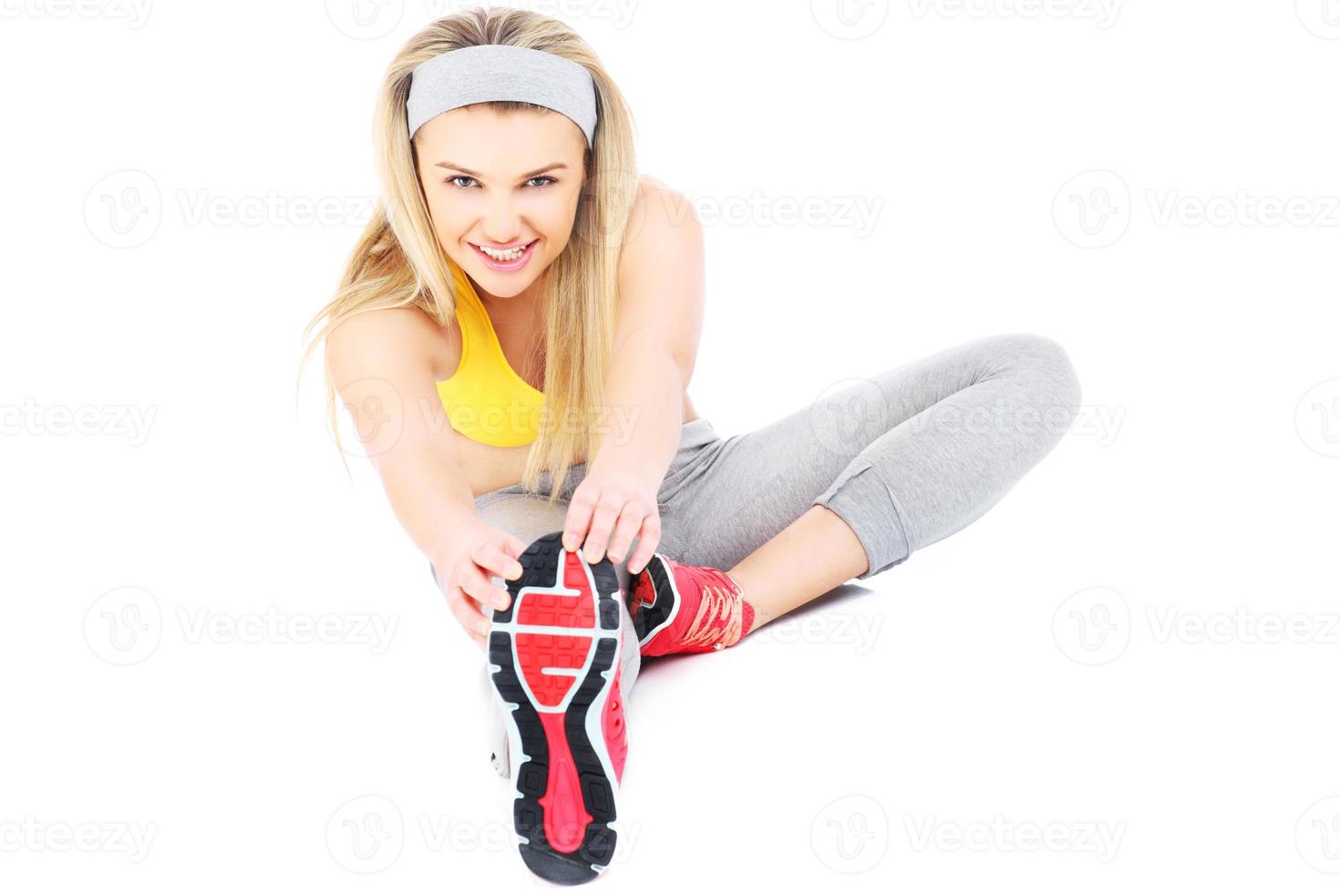 Pretty woman stretching photo