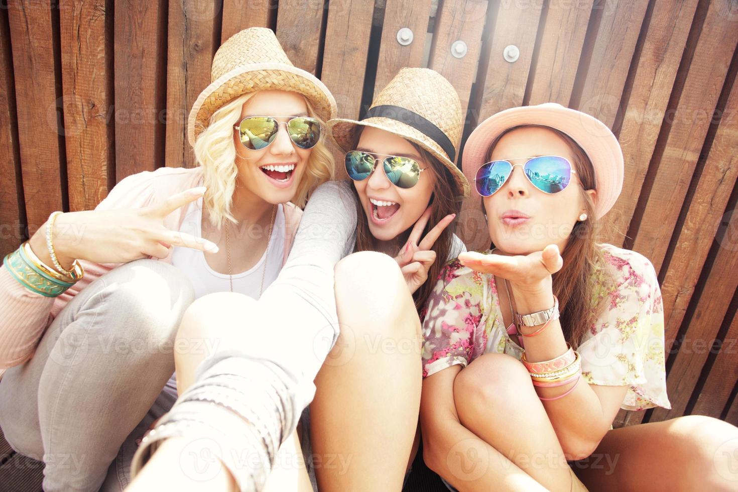 Group of friends taking selfie in the city photo