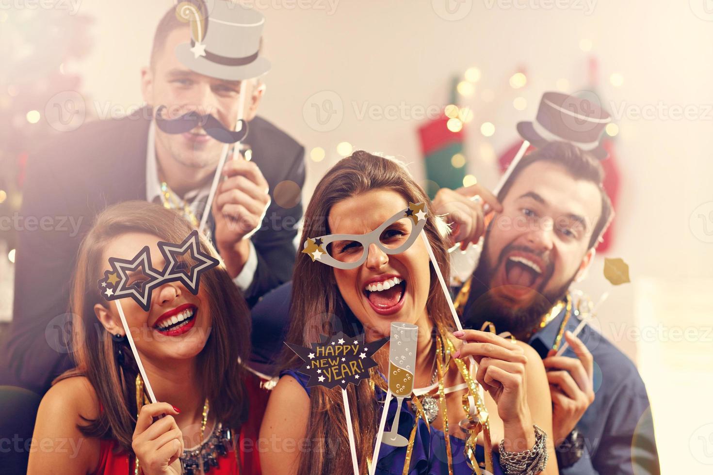 Group of friends celebrating New Year photo
