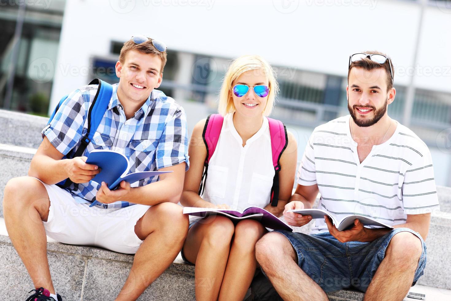 Group of friends studying in the campus photo