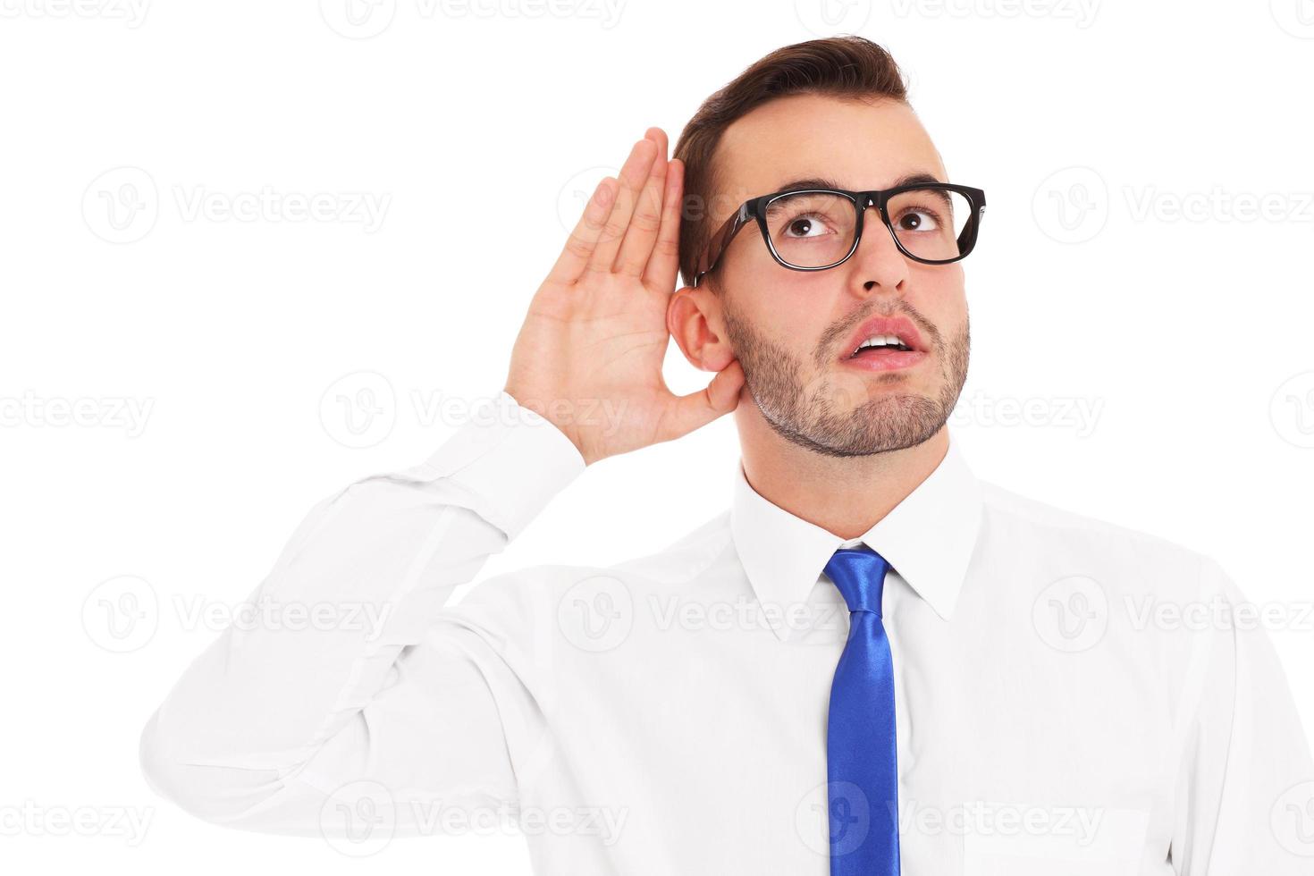 Happy businessman listening to something photo
