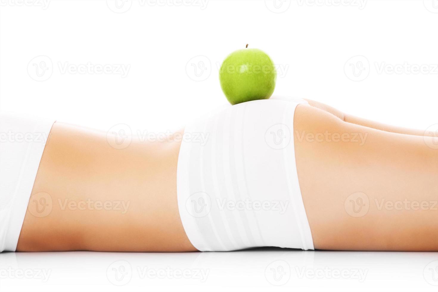 Green apple on body photo