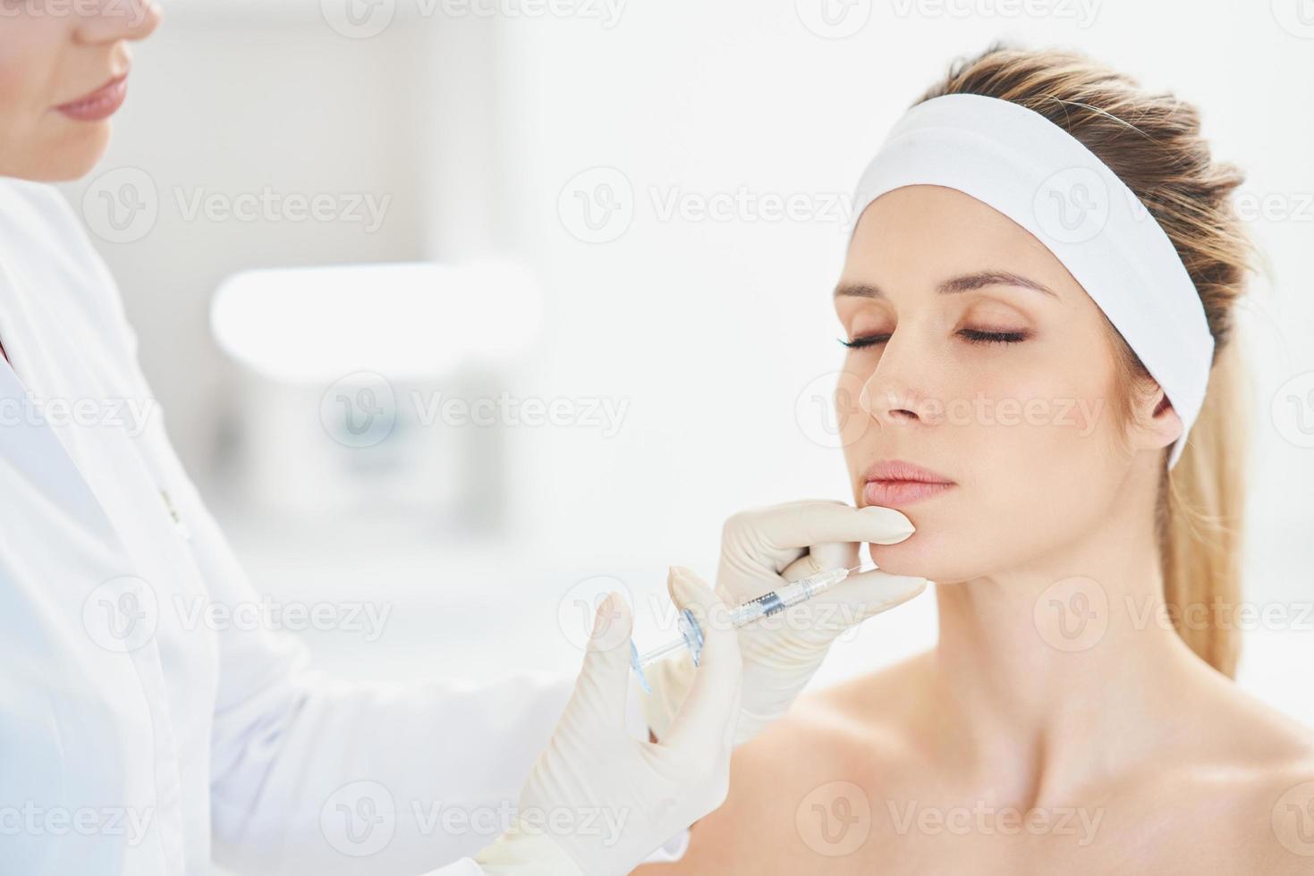 A scene of medical cosmetology treatments botox injection. photo