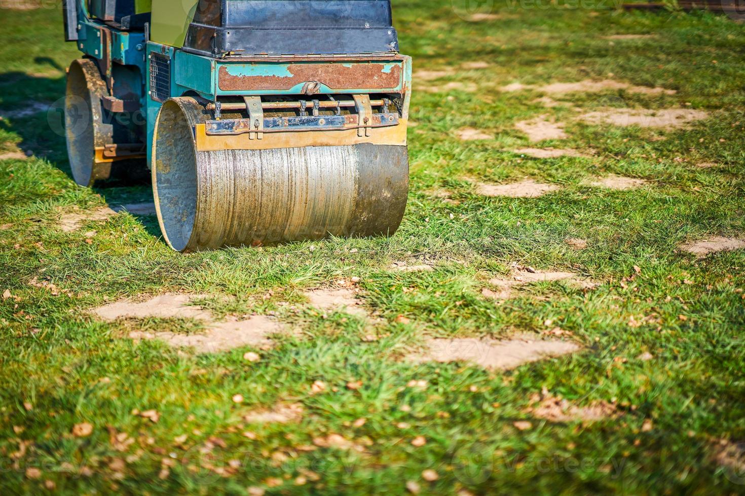 Picture of a road roller machine on the different surfaces photo