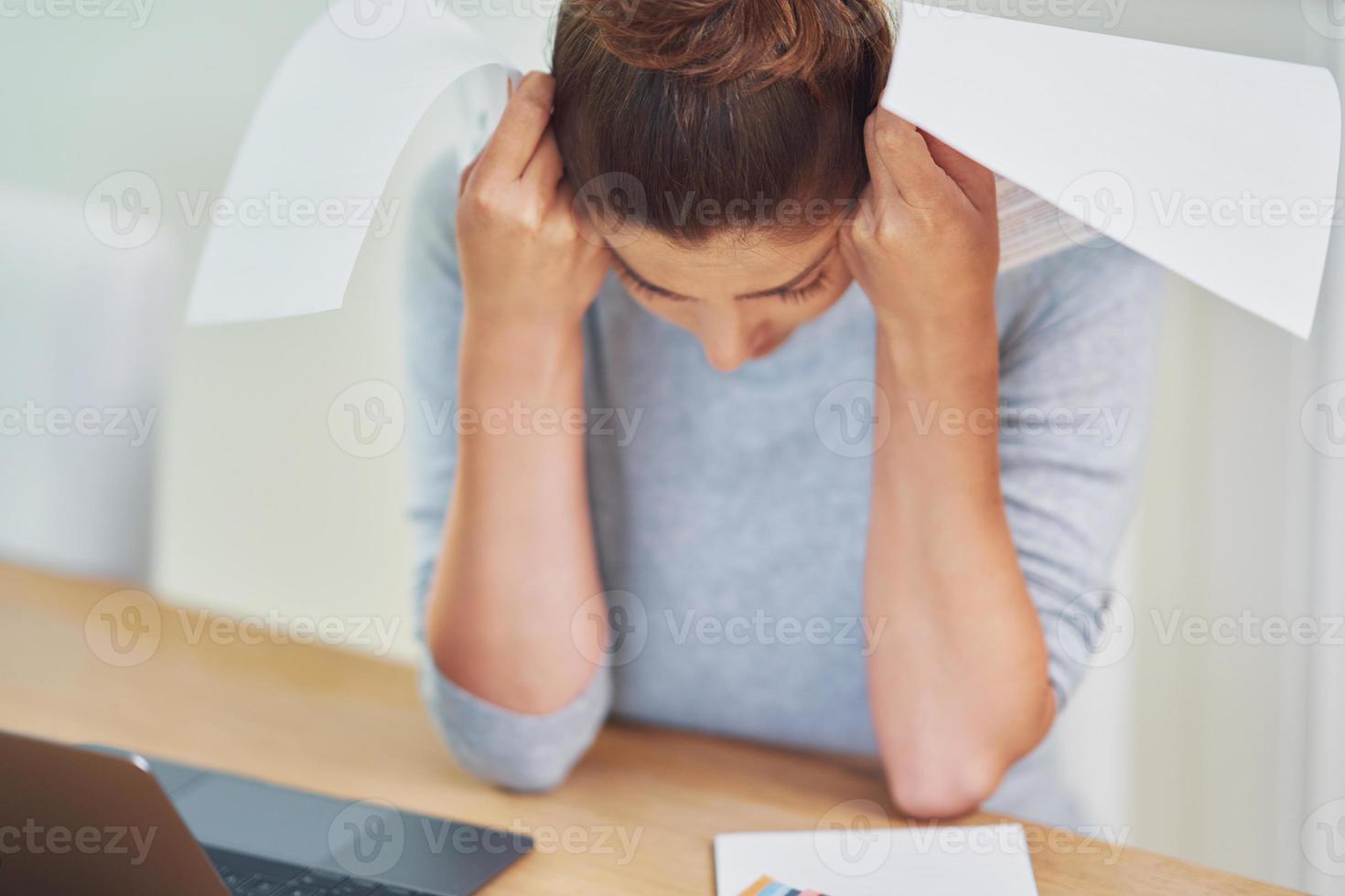 Young woman counting home budget with bills photo