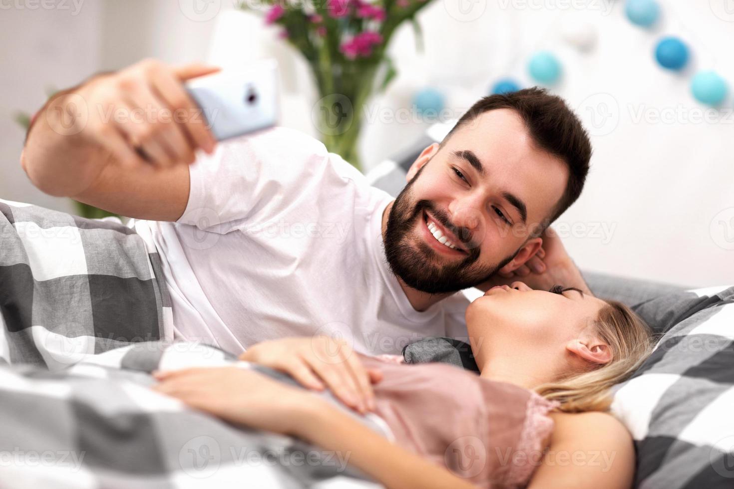 Adult attractive couple in bed photo