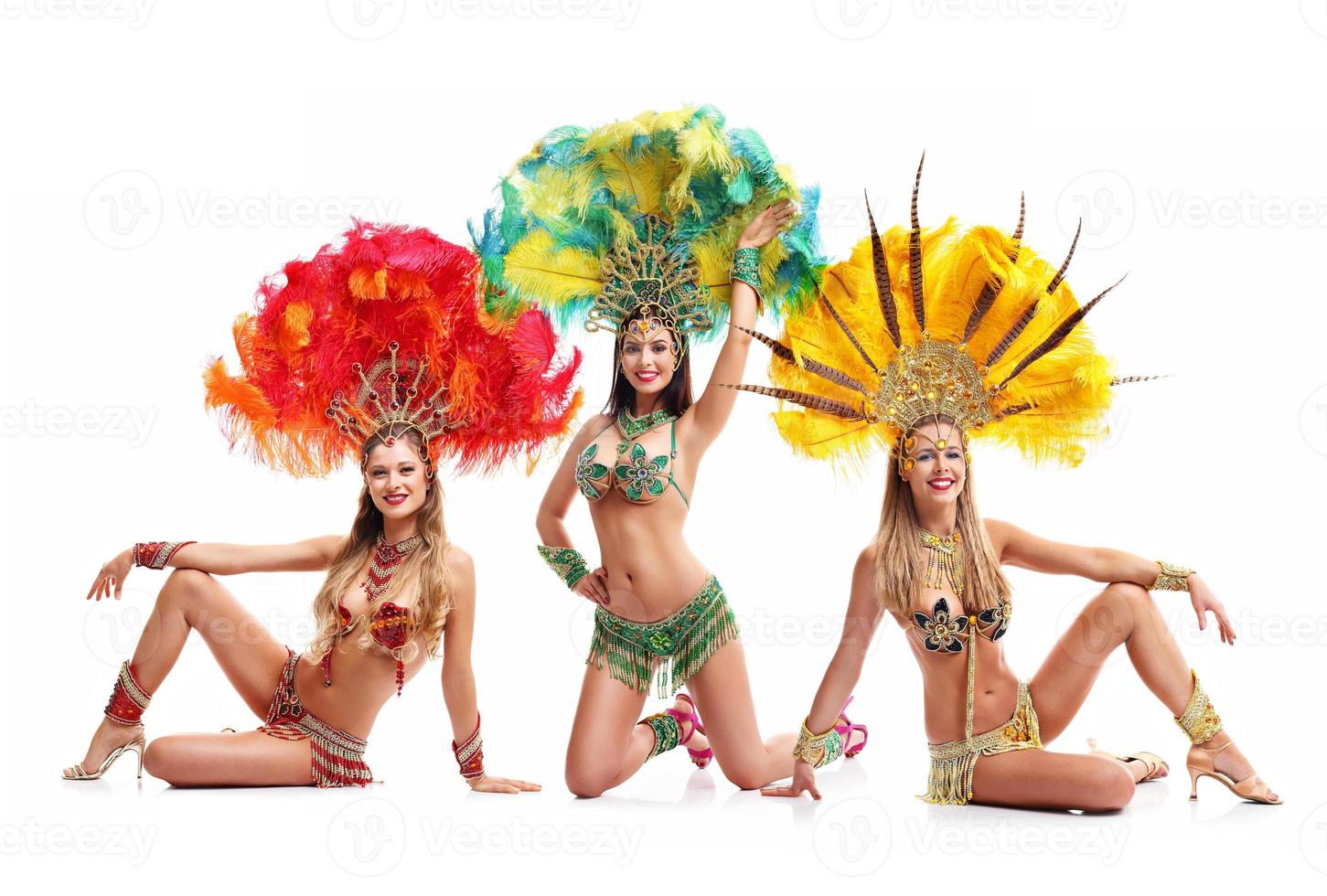 Brazilian women dancing samba over white background photo