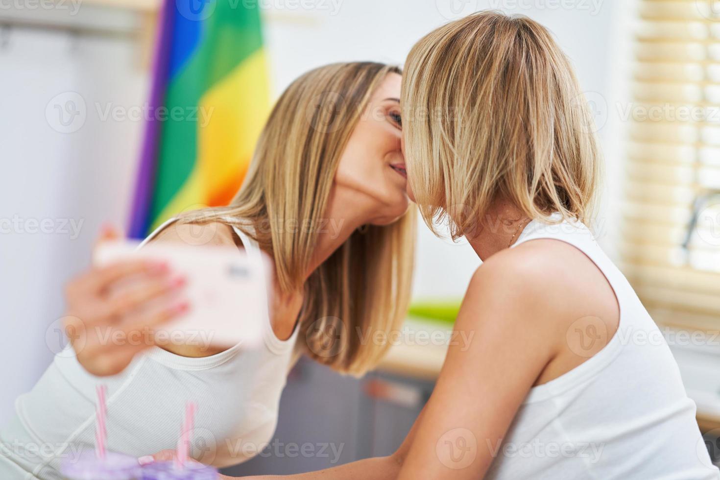 LGBT Lesbian couple love moments in the kitchen happiness concept photo