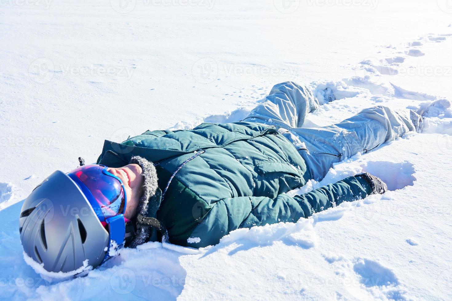 Young person having fun on the snow photo