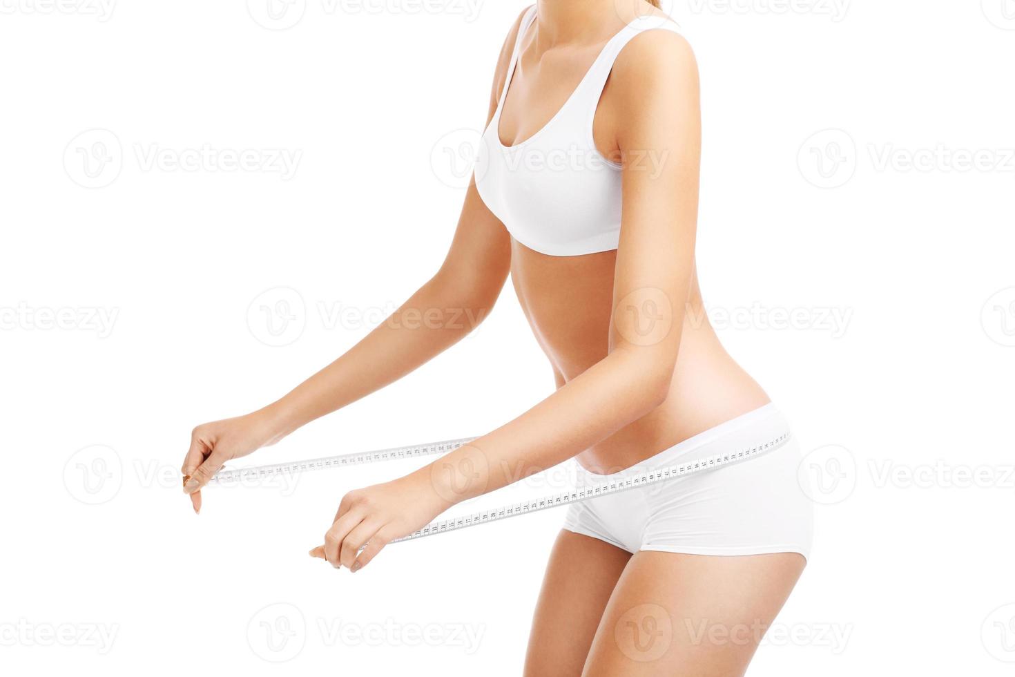 Fit woman with tape measure photo