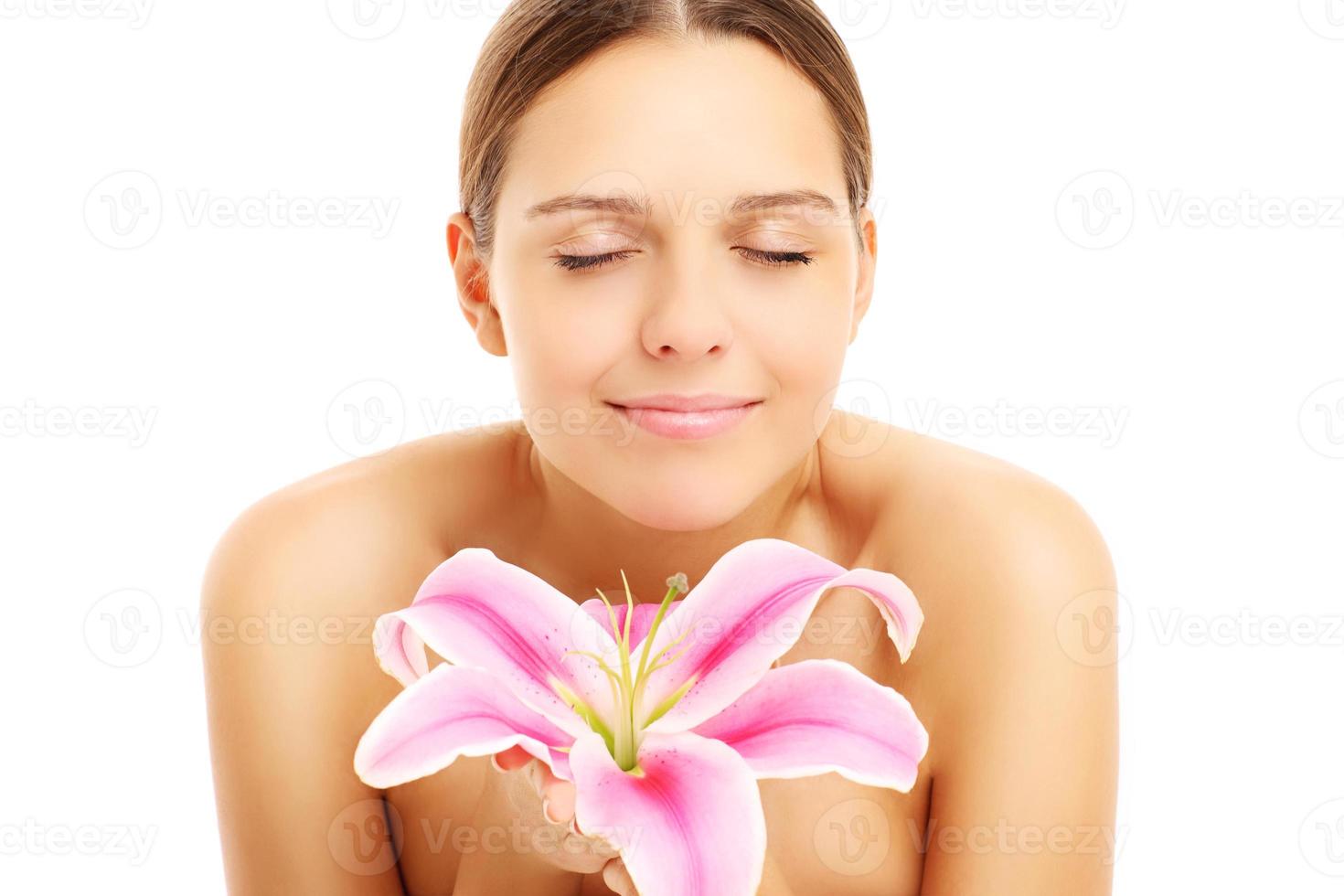 Pretty woman posing with flower photo