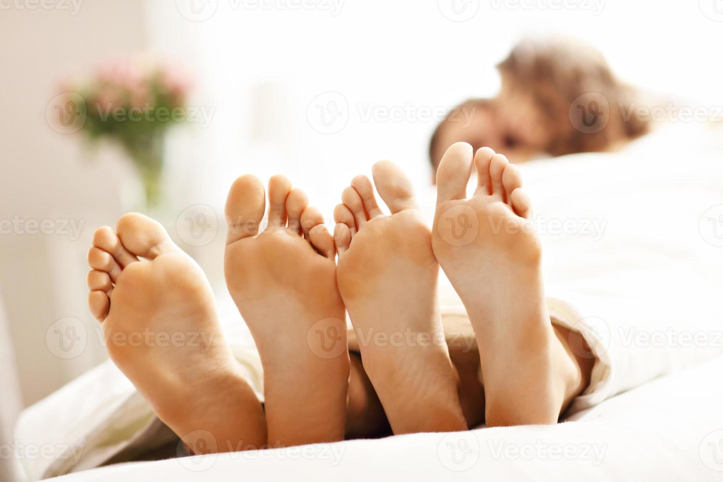 Happy couple resting in bedroom photo