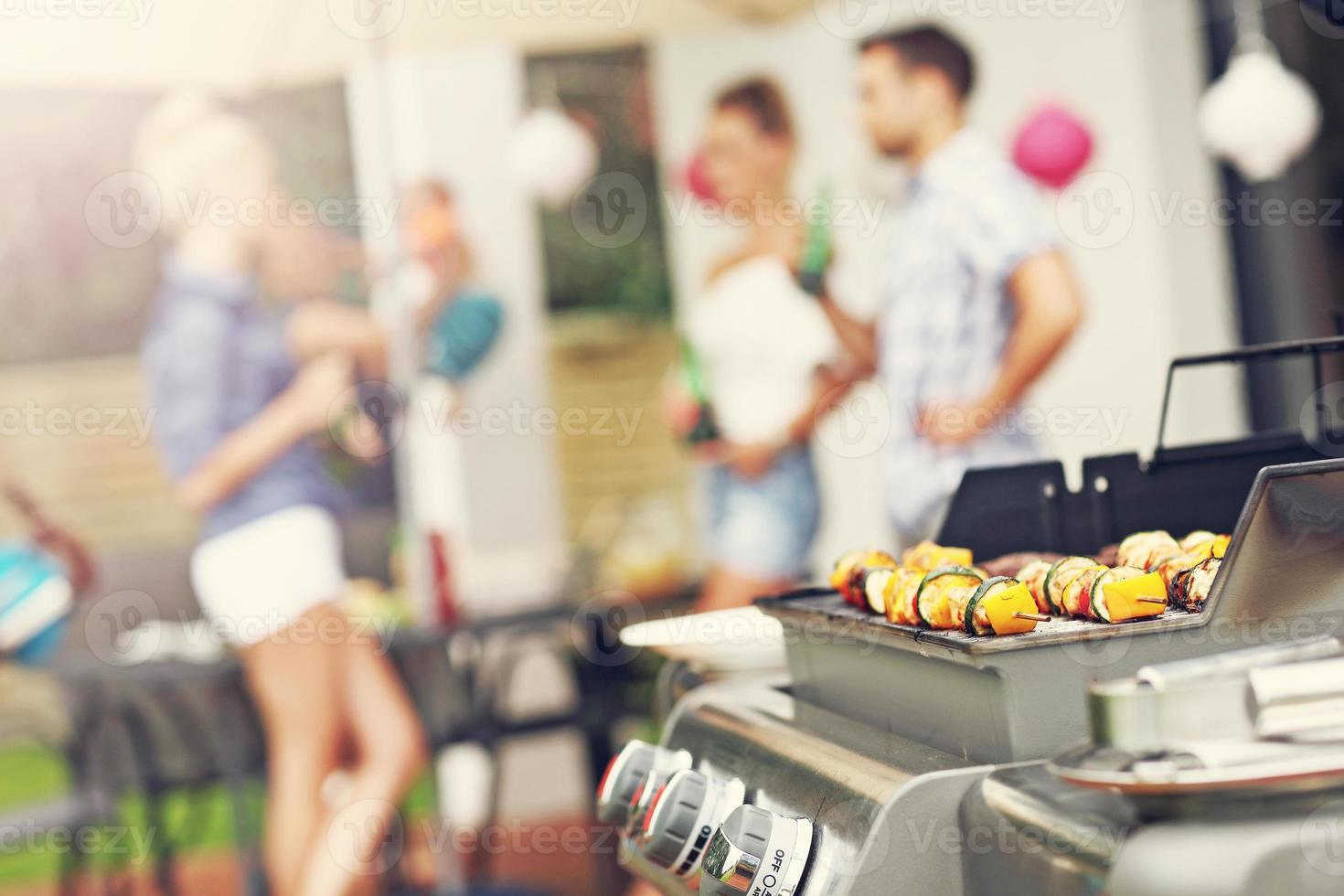 Grilled shashliks and hamburgers on grate photo