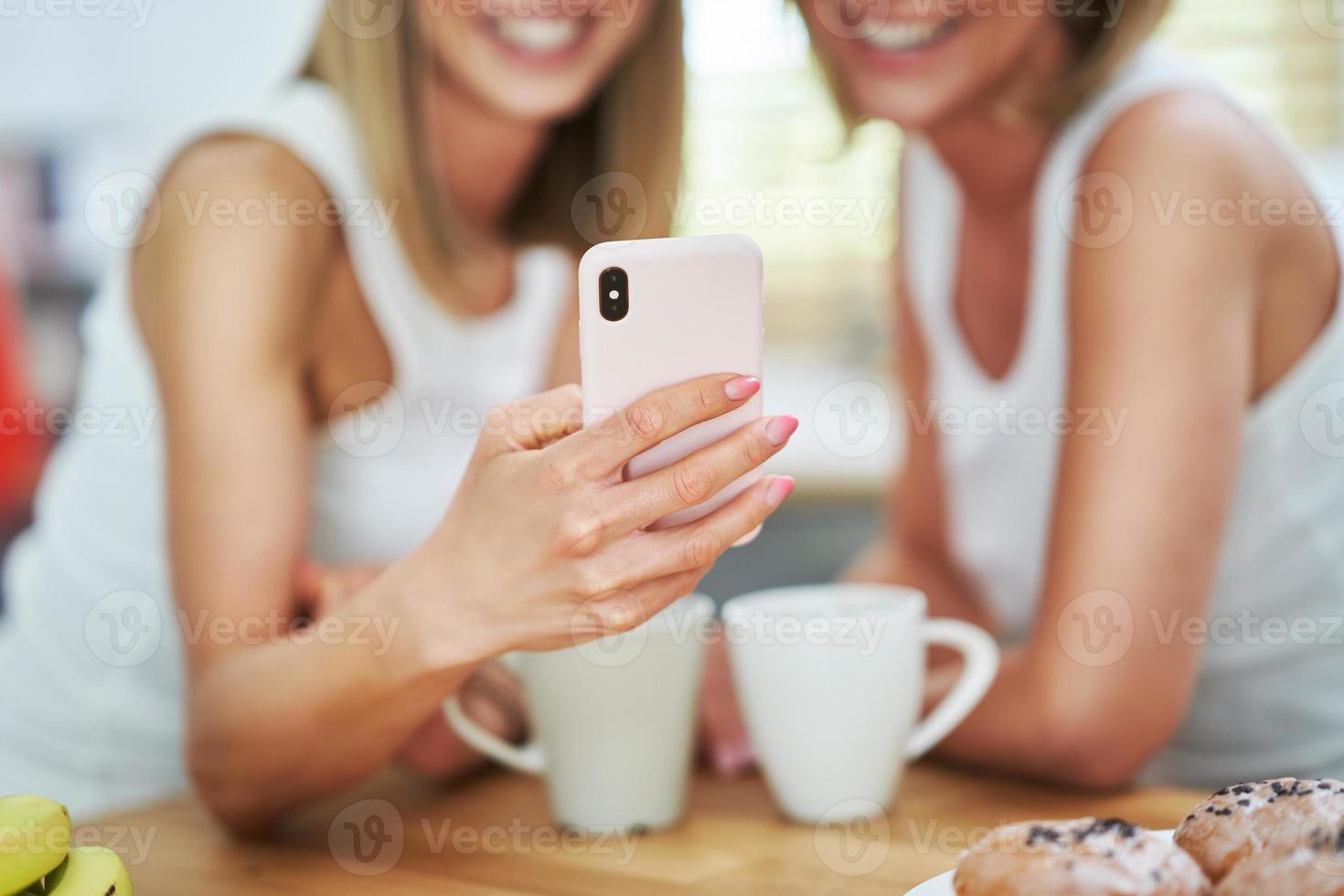 LGBT Lesbian couple love moments in the kitchen happiness concept photo