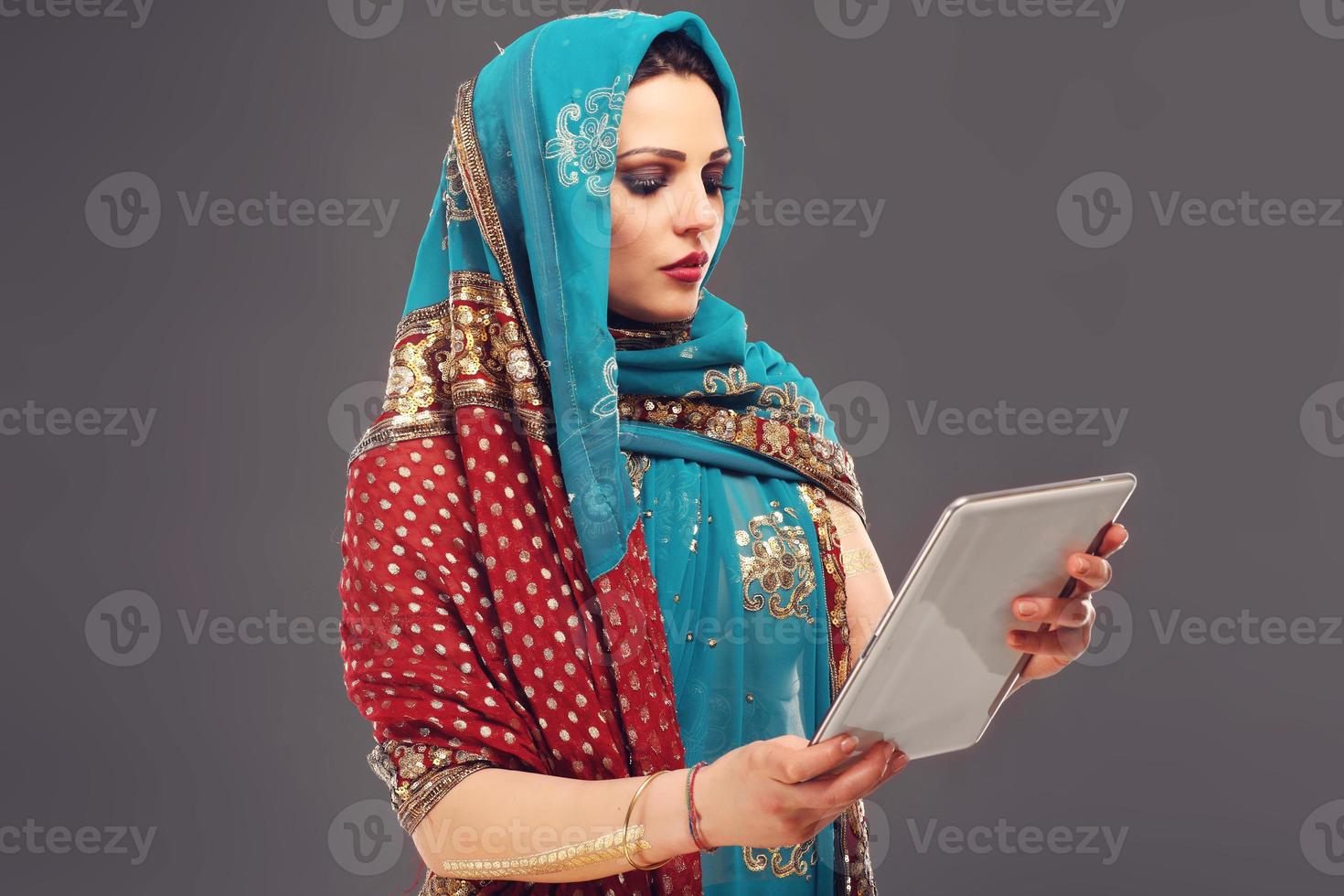 Arabic woman using tablet photo