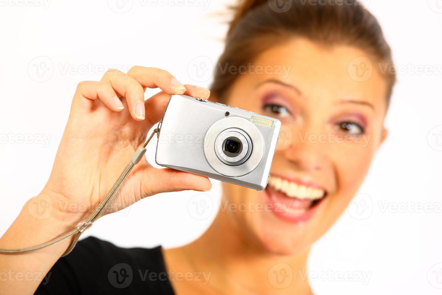 Young woman taking pictures photo