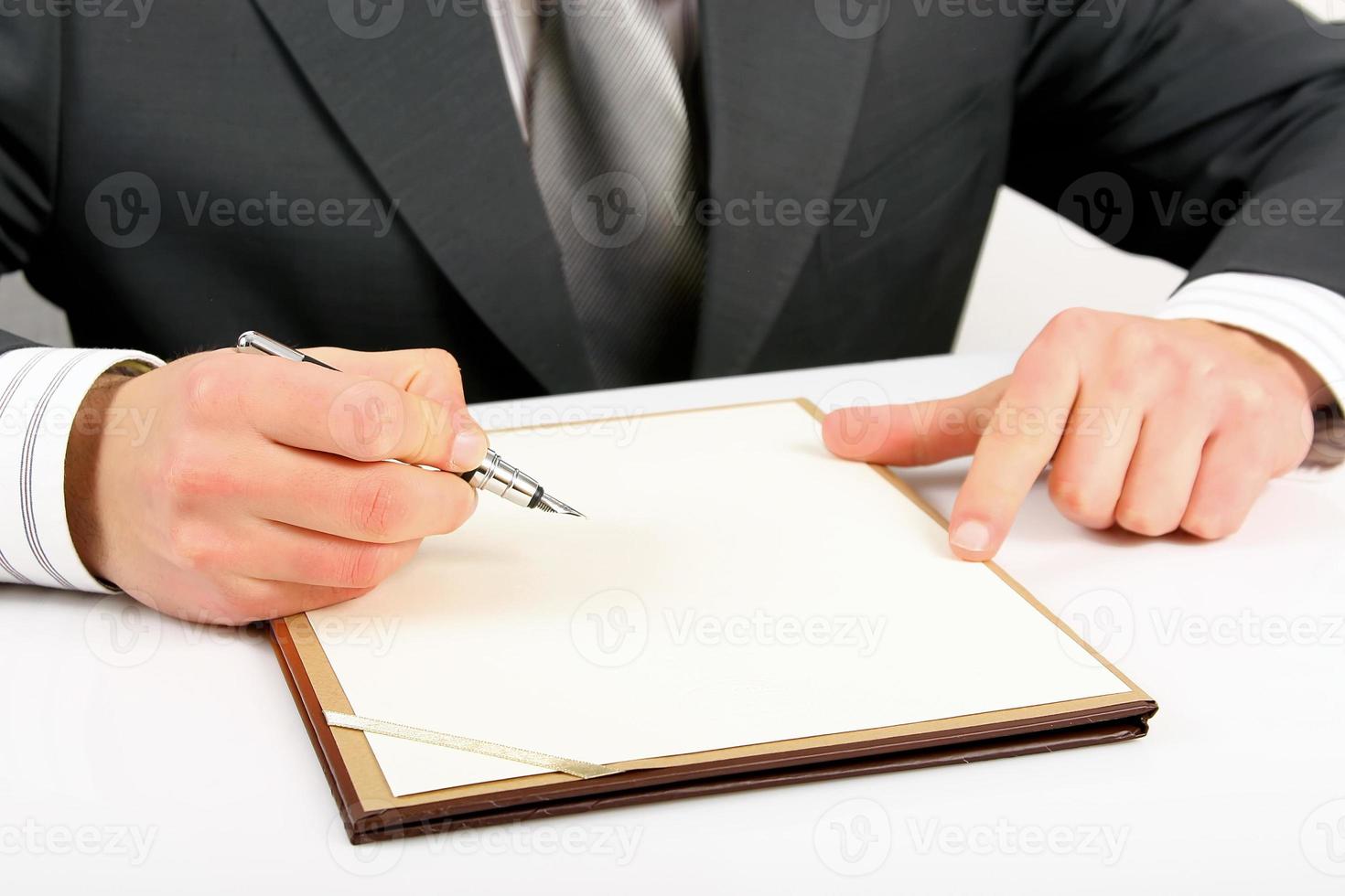 businessman writing on paper photo